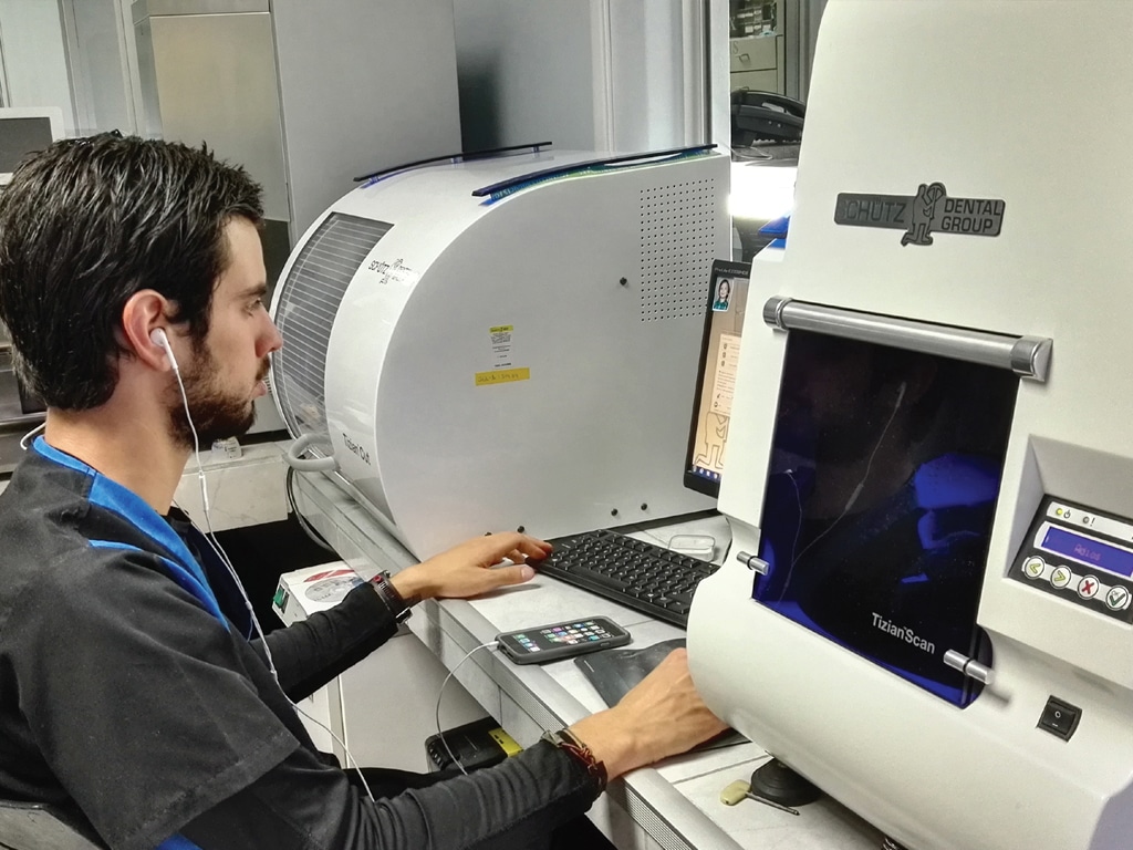 A Marco Munoz Cavallini dental technician using CAD software to design dental implants for one of our patients.